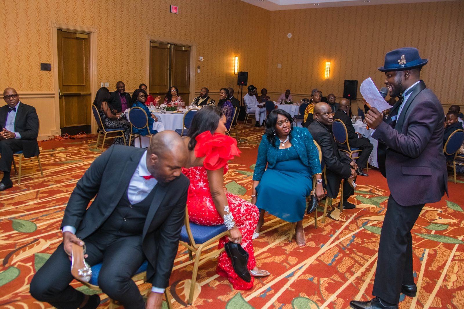 Atlanta corporate awards ceremony MC presenting honorees on stage