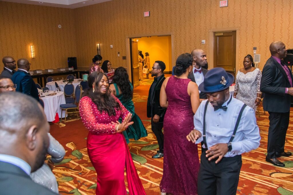 Mclevioflife MC leading a wedding reception with a joyful crowd